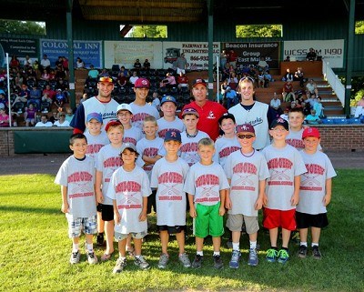 Assistant coach Doug O'Brey with members of his baseball camp